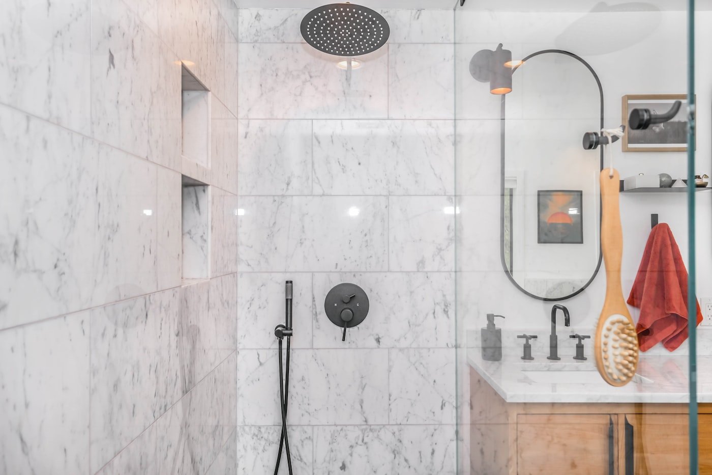 Walk-in shower with a tiled surround and a glass panel